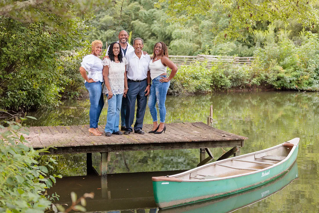 Family of five on the dock by the pond at Turnipseed Nursery Farms in Fayetteville GA.
